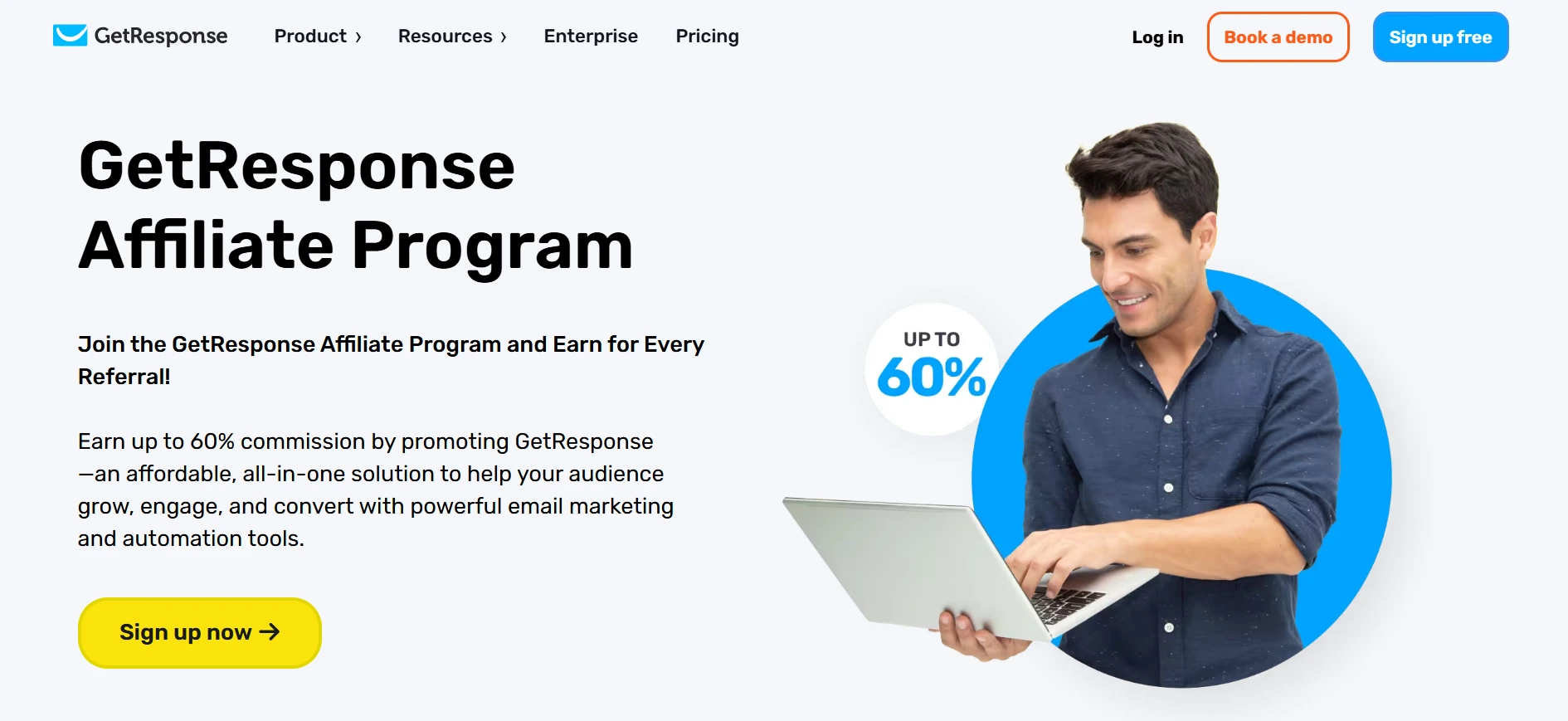 A man smiles while looking at a laptop, with a "60%" graphic beside him, on a webpage promoting the GetResponse Affiliate Program.